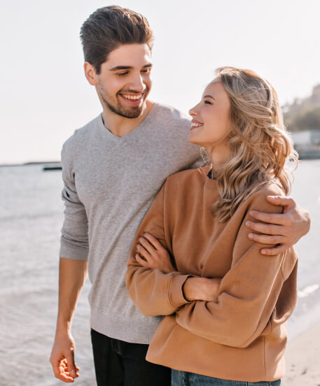 Couple happily looking at each other and smiling