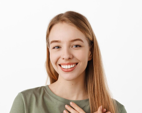 A young woman is smiling